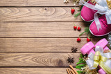 Fototapeta Tulipany - Fitness and Healthy Christmas sport composition. Flat lay of sport shoes, dumbbells and decoration bows. Merry Christmas and Happy new year concept special for fitness healthy lifestyle. 