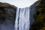 Fototapeta Mapy - Mist Rising up from the Cliffs of Skogafoss Waterfall in the Golden Circle of Iceland