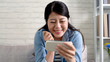 © PRPicturesProduction - housewife using mobile phone smiling on talk show
