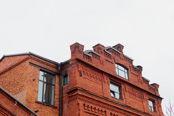 brick tower at the old building against the sky