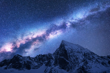 Wall Mural - milky way above snowy mountains. space. fantastic view with snow covered rocks and starry sky at nig