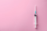 Fototapeta Dmuchawce - Syringe with liquid on color background