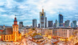 Frankfurt, Germany - November, 2018: View to skyline of Frankfurt during sunset. St. Catherine's Church and the Hauptwache Main Guard building with famous Frankfurt skyscrapers.