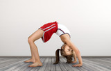 little girl doing exercises gymnastic
