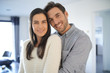 © goodluz - Portrait of gorgeous couple embracing at home