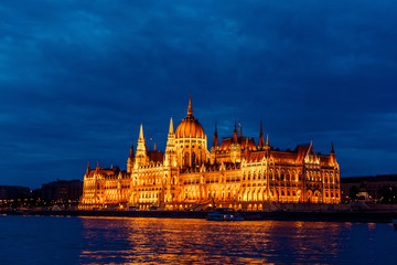 Budapest Parliament in Hungary at night on the Danube river