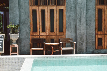 old wooden chair with vintage wooden wall