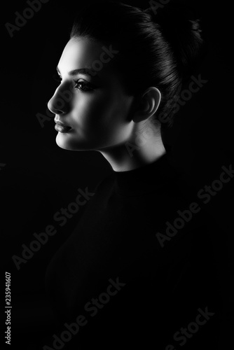 Side Portrait Of Young Beautiful Woman With Her Hair Scraped Back