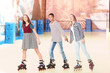 © Africa Studio - Group of teenagers at roller skating rink