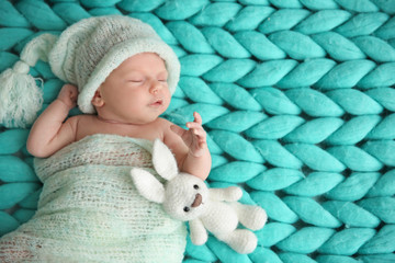 Wall Mural - Cute newborn baby girl lying on plaid