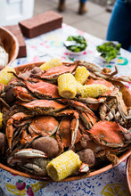 Blue Crab Boil With Corn On The Cob In Large Bowl