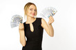 © Alexander - Portrait of a young smiling blonde girl with money dollars in hands isolated white background.
