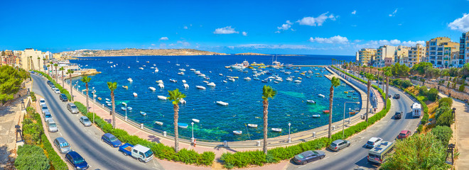 Poster - BUGIBBA, MALTA - JUNE 14, 2018: The panoramic view on the St Paul's Bay of Bugibba resort with small fishing harbour and seaside promenade, on June 14 in Bugibba.