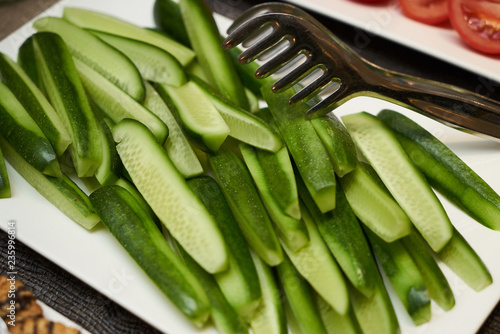 Fotografie, Obraz Sliced cucumber plate on a catering buffet food table