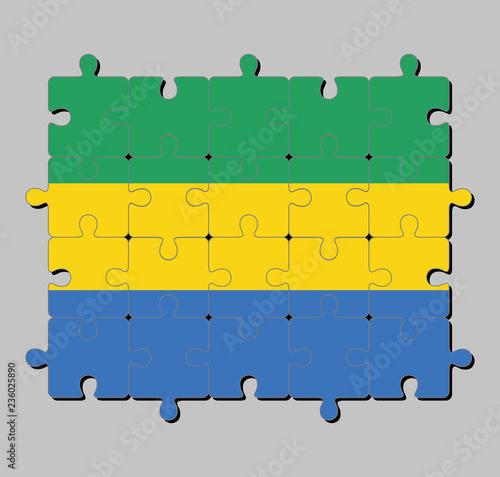 Fotografie, Obraz Jigsaw puzzle of Gabon flag in a horizontal triband of green, gold and blue