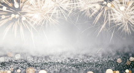 Wall Mural - gold and silver fireworks and bokeh in new year eve and copy space. abstract background holiday.