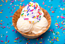 Vanilla Ice Cream In A Waffle Cone Bowl On A Blue Background