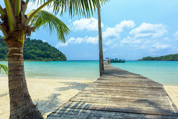 Wall Mural - Long wooden bridge go to the sea in beautiful tropical island, Thailand.