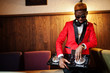 © AS Photo Family - Fashion african american man model DJ at red suit with dj controller.