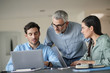 © goodluz - Young colleagues with older boss working with computers