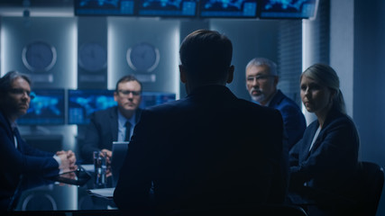 Chief Strategy Officer Making Report to a Board of Directors During Annual Financial Meeting in the conference Room. Business People / Politicians / Government Officials on a Meeting.