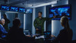 © Gorodenkoff - High-Ranking Military Man holds a Briefing to a Team of Government Agents and Politicians, Shows Satellite Surveillance Footage.