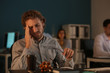 © Pixel-Shot - Tired IT specialist working in office