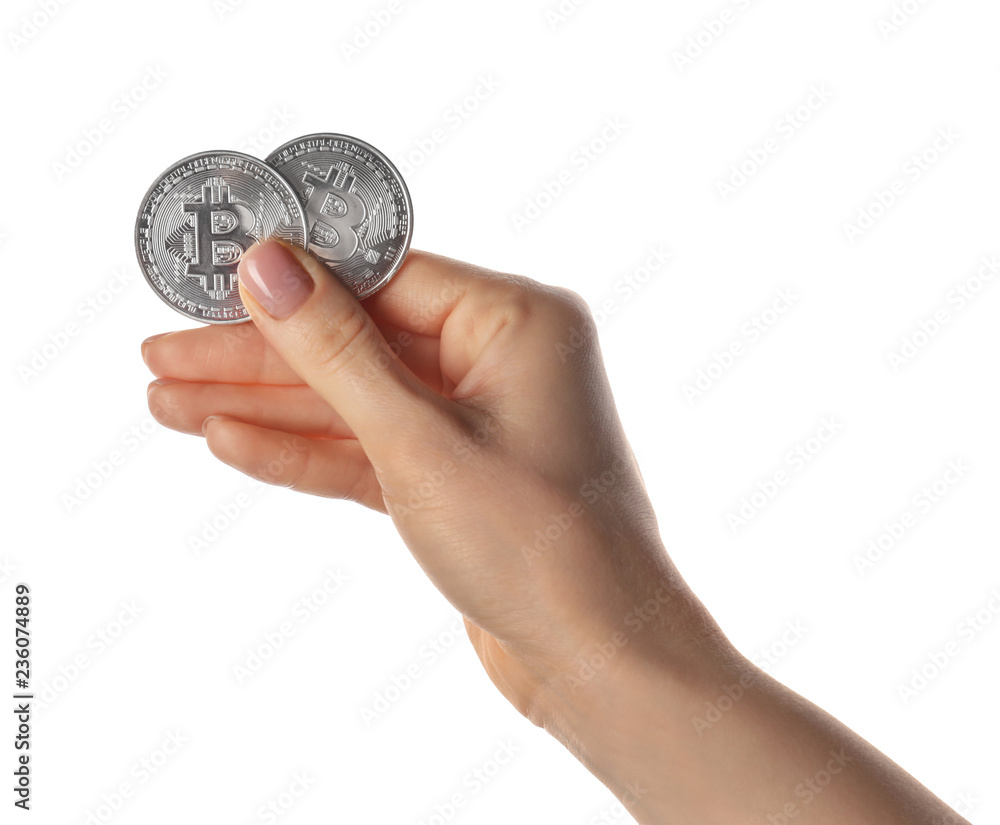 Female hand with bitcoins on white background