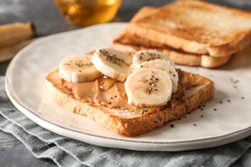 Plate with sweet toast on table, closeup