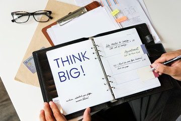 Poster - Phrase Think big written on a notebook