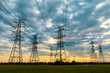 © ABCDstock - high-voltage power lines at sunset,high voltage electric transmission tower