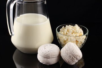 Poster - Marshmallows and dairy products on a dark background