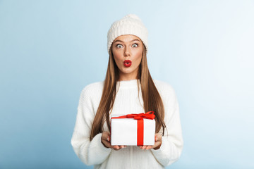 Wall Mural - Happy young woman wearing sweater