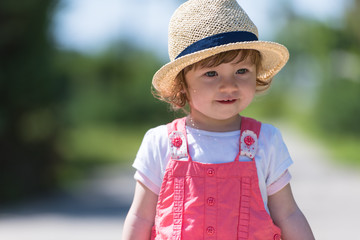 little girl runing in the summer Park