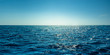 Leinwanddruck Bild - Blue ocean panorama with sun reflection, The vast open sea with clear sky, Ripple wave and calm sea with beautiful sunlight