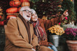 © Yakobchuk Olena - Portrait of cheerful old lady hugging husband and pointing at something while gentleman laughing