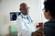© Gregory Miller - Doctor speaks with patient