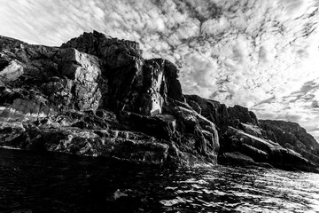 Wall Mural - Coastline of Barents sea in northern polar summer. Black and white image. Arctic ocean, Kola Peninsula, Russia