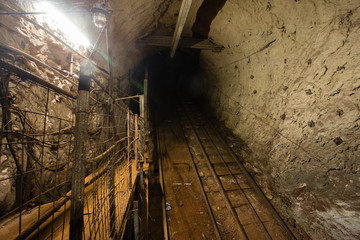 Underground gold iron ore mine shaft incline tunnel gallery passage human road