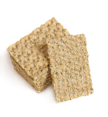 Wall Mural - One main crispbread against the background of stack of crispbread with sesame isolated on white