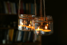 Aromatic Candles In Jars Hanging In Interior. DIY Candles In Glass Jars Hanging On Linen Jute. 