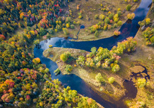 Low Level Aerial Photograph Featuring Fall Foliage In The Adirondack Park Of New York State Featuring Peak Fall Foliage Colors Near Saranac Lake, NY And The Saranac River.