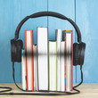 © SOLDATOOFF - headphone and books on blue background