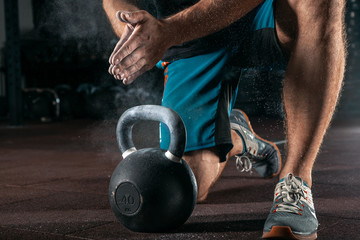 Kettlebell training in gym. Athlete doing workout