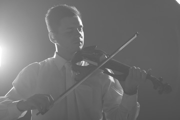 Wall Mural - The musician plays the electronic violin. Violin close up. 