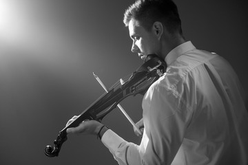 Wall Mural - The musician plays the electronic violin. Violin close up. 