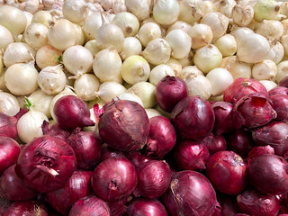 sale, food, vegetables and agriculture concept - close up white, red onion background