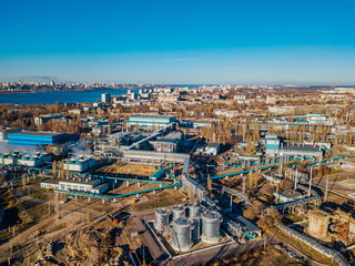 Wall Mural - Chemical factory industrial area. Aerial view. Large vats connected by pipeline 