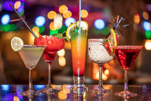 Alcoholic Cocktail Row On Bar Table, Colorful Party Drinks