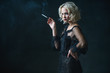 © Andrey Kiselev - woman smoking cigarette